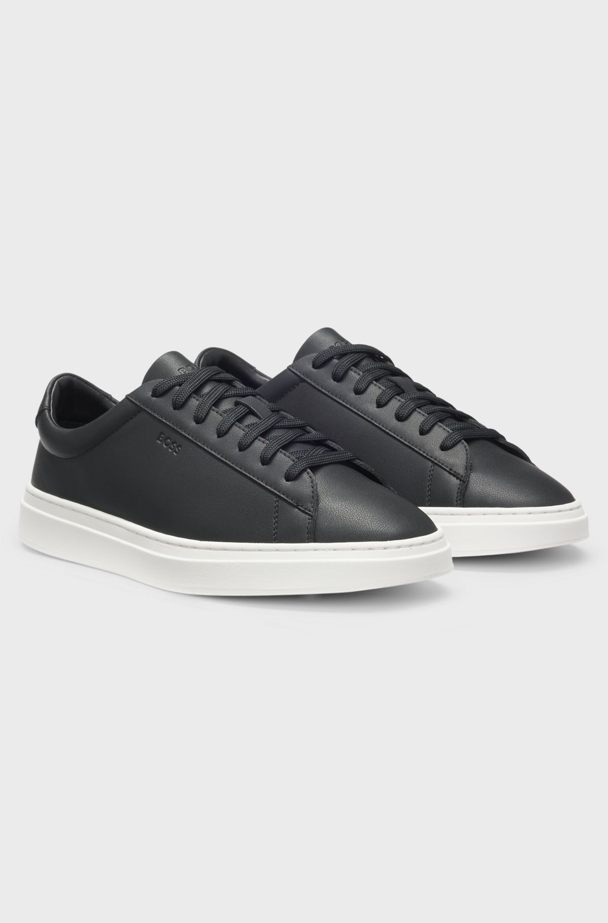 Cupsole trainers in leather with signature-stripe stitching, Black