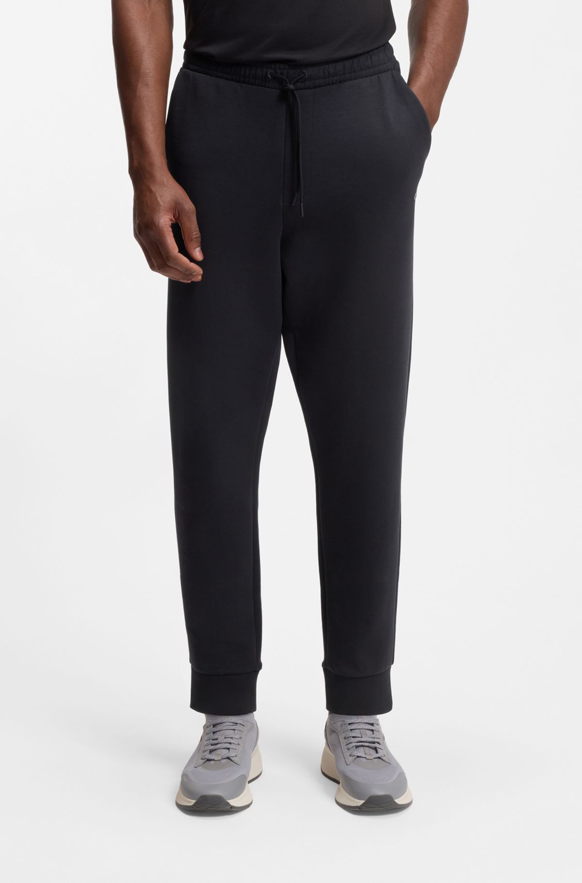 Stretch-cotton tracksuit bottoms with logo print, Dark Blue